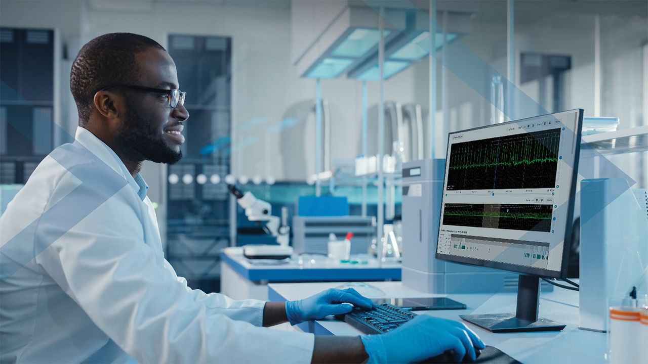 Man at computer reviewing remote cardiac monitoring patient data through the portal.