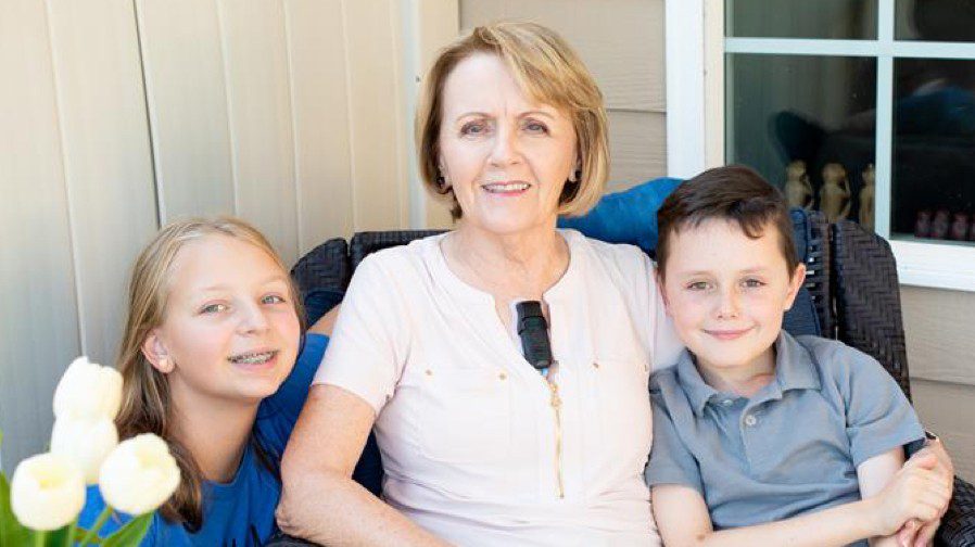 BodyGuardian Remote Cardiac Monitor patient Barbara sitting with her grandchildren.